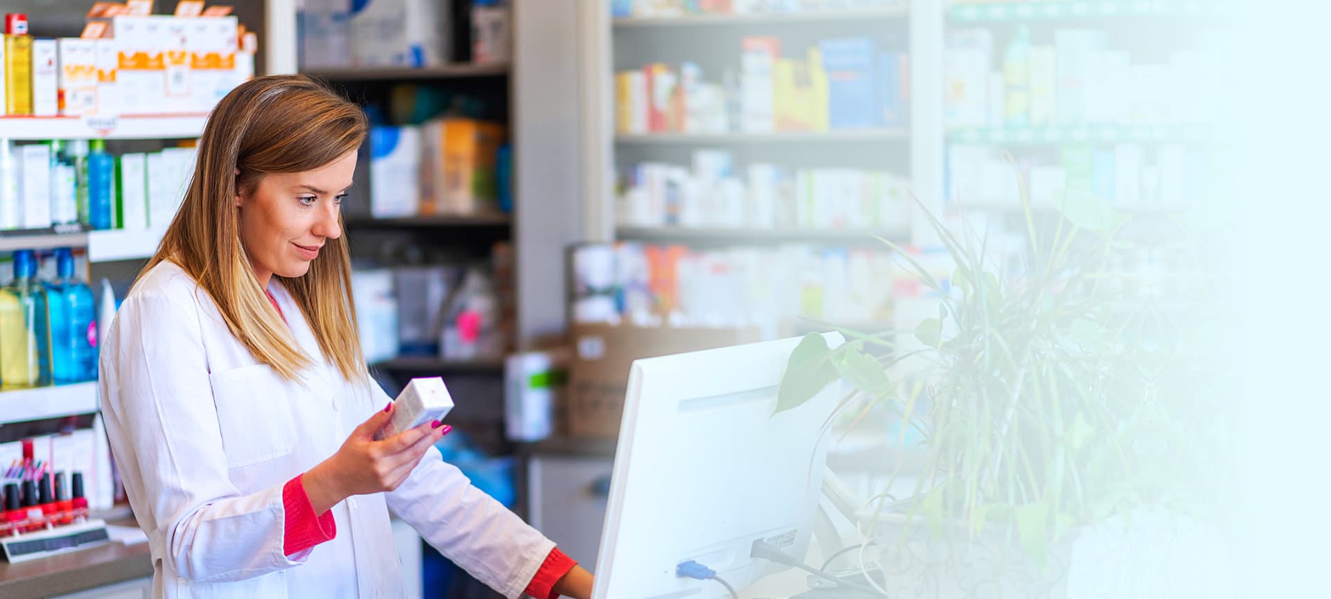 pharmacist checking info of a medicine