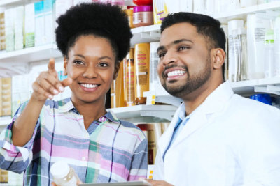 pharmacist and customer smiling