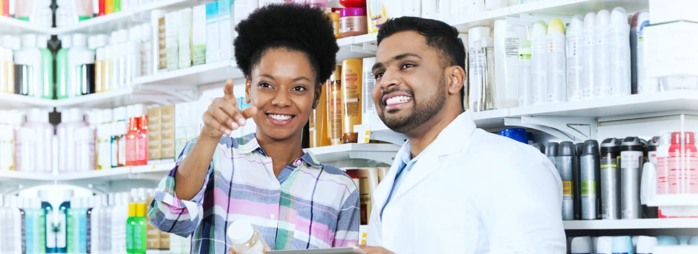 pharmacist and customer smiling